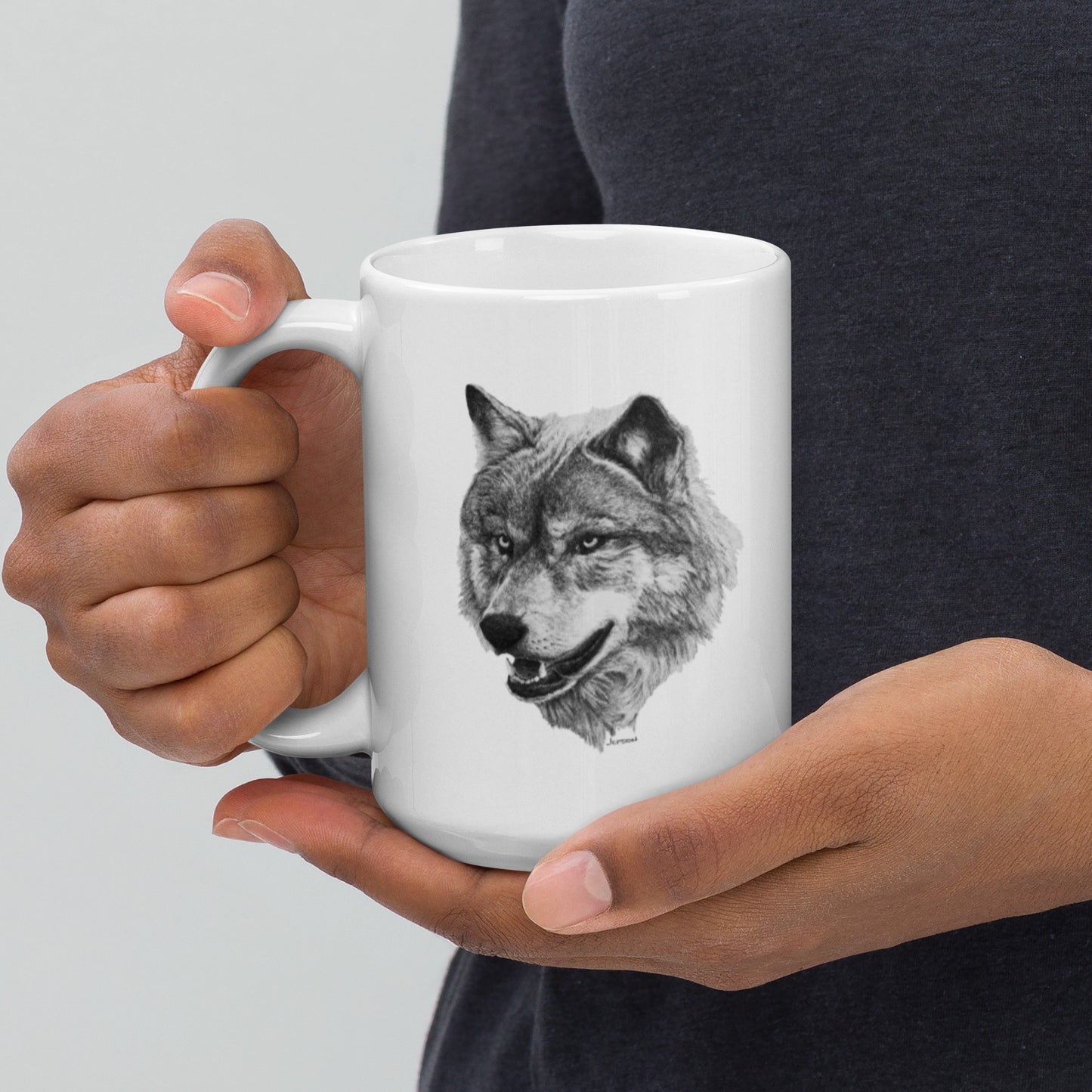 This "Wolf White Glossy Mug" is from a drawing of mine created with a graphite pencil. It has been digitally optimized and transferred to a 15oz white glossy mug.