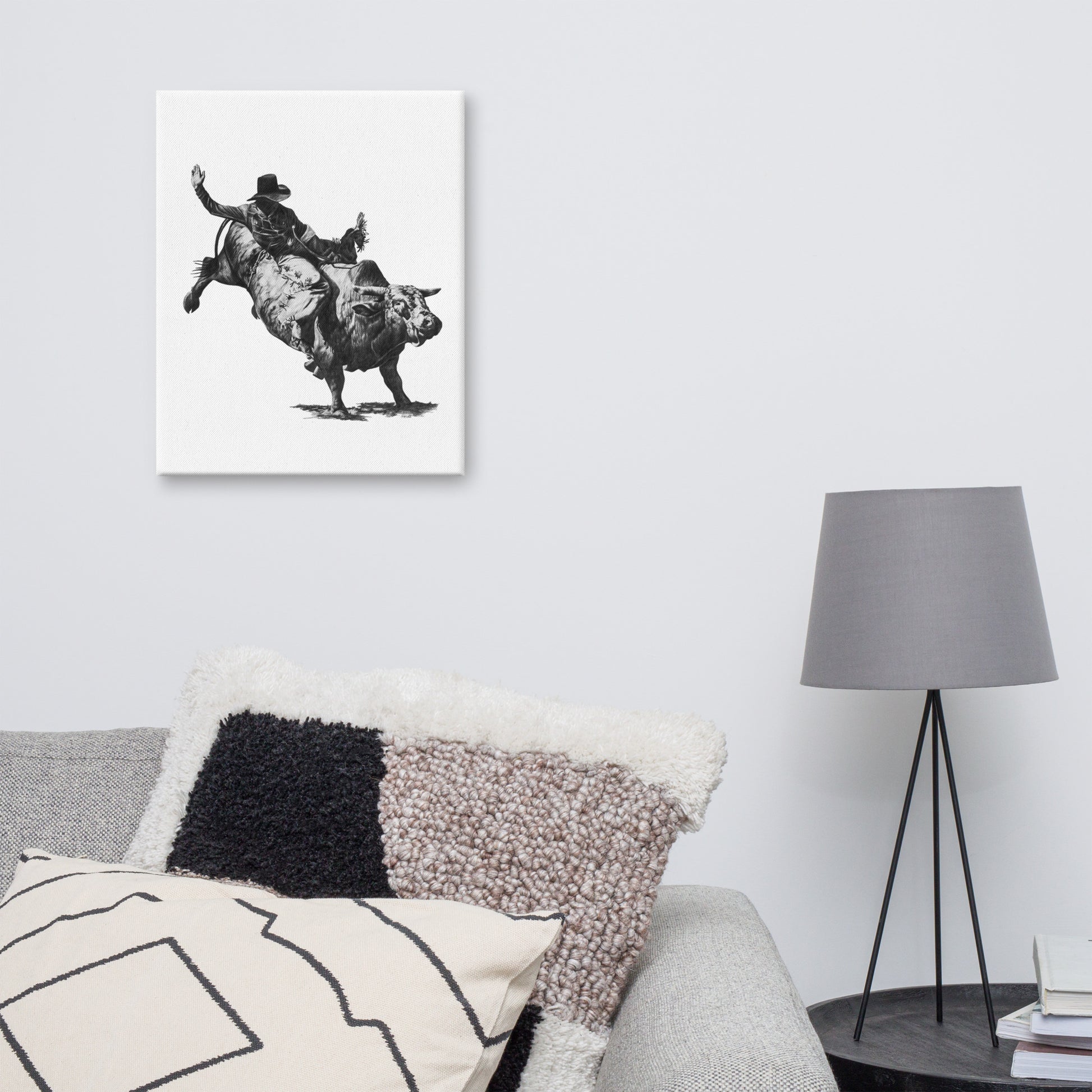 These "Bull Rider Canvas Wall Hangings" are from a drawing of mine created with a graphite pencil of a cowboy on a bucking bull. It has been digitally optimized and transferred to a poly-cotton blend canvas.