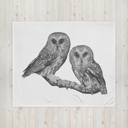 "Owl Throw Blanket" is of two owls sitting on a branch with a "Who's That" look, drawn with a graphite pencil.