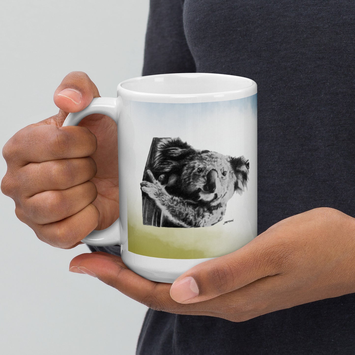 This "Koala White Glossy Mug (B)" is from a drawing of mine created with a graphite pencil. It has been digitally optimized and transferred to a 15oz white glossy mug.