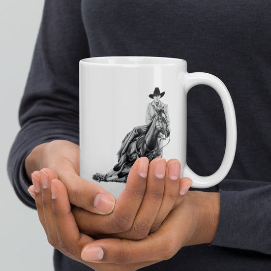 This "Cowboy White Glossy Mug" is from a drawing of mine created with graphite pencil. It is titled "A Cut Above" as it is a cowboy on a cutting horse. It has been digitally optimized and transferred to a 15oz white glossy mug.
