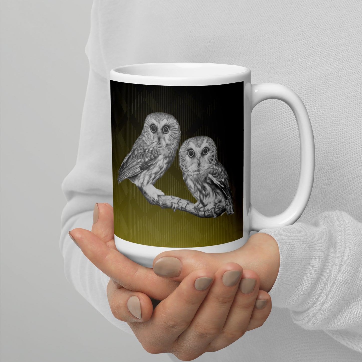 The "Owl White Glossy Mug" is of two owls sitting on a branch with a "Who's That" look, drawn with a graphite pencil on Hammermill Bond paper.